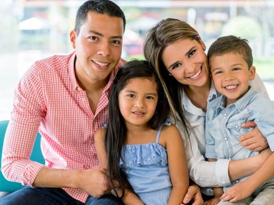 Family smiling for photographer