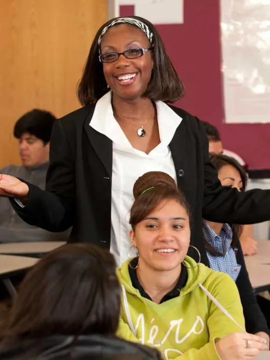 Volunteer presenting to students